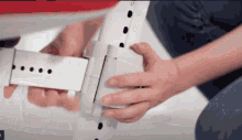 a close up of a person 's hands holding something