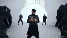 a man is dancing in front of a white wall with the hashtag therefaceplace