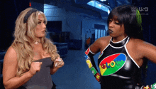 two women are standing next to each other with one wearing a glow shirt