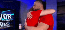 Survivor Series 2022 Backstage Sami Zayn Hugs Roman Reigns GIF - Survivor Series 2022 Backstage Sami Zayn Hugs Roman Reigns GIFs