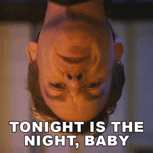 a man is upside down with the words tonight is the night baby above his head
