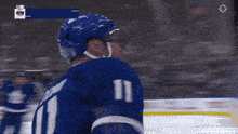 a hockey player with the name domi on his jersey