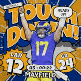 a football player with the number 17 on his jersey holds up his fist
