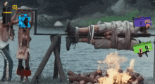a man is tied up on a spit over a fire with a purple box that says ' ii ' on it