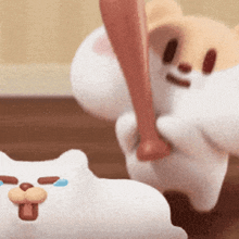 a stuffed animal is holding a baseball bat and hitting another stuffed animal .