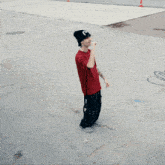 a person wearing a red t-shirt with the word passive on it