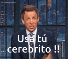a man in a suit says usa tu cerebrito