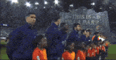 a group of players stand in front of a sign that says this is la park