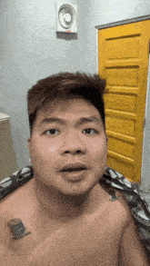 a shirtless man with a tattoo on his chest that says " no bitch "