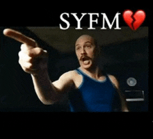 a man in a blue tank top is pointing at the syfm sign
