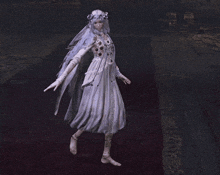 a woman in a white dress with a veil on her head