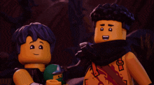 two lego figures are standing next to each other