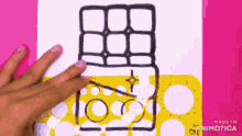 a person is drawing a chocolate bar with a ruler