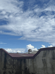 a red roof with a dome on top of it