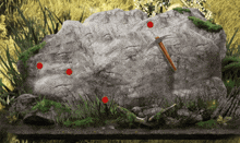 a large rock with a pickaxe on it and red circles around it
