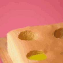 a piece of cake with holes in it and the words mr.cakes below