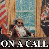 a man in a wig and sunglasses sits at a desk with the words on a call above him
