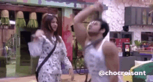 a man and a woman are dancing in a room with the words chocroissant on the bottom