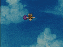 a cartoon character is doing a handstand in the sand on the beach