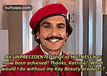 a man with a mustache is wearing a red beret and a red jacket and is smiling .