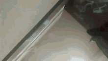 a close up of a glass with a reflection of a person 's face