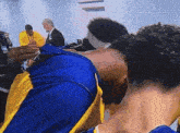 a man in a blue and yellow jersey with the letter s on it