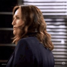 a close up of a woman 's face with the hashtag svu on the bottom left