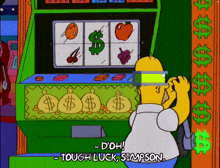 homer simpson is playing a slot machine and says " tough luck simpson "
