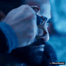 a close up of a man 's face with 7wickreddy written on the bottom right