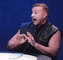 a man in a leather vest says aa aa aa aa aa