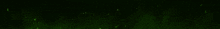 a green light is shining on a black background with the word next .