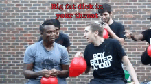 a man wearing a shirt that says boy better know is holding balloons