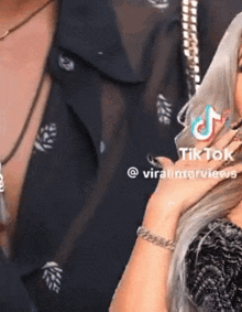 a woman with a tiktok icon on her hand