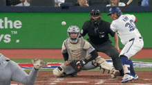 a baseball player named karry is swinging at a ball