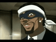 a man in a suit and tie is wearing a mask and a bandana on his head .