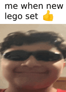 a boy wearing sunglasses is smiling with the words me when new lego set above him