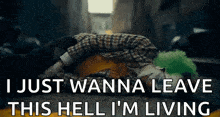 the joker is laying on the ground with the words `` i just wanna leave this hell i 'm living ''