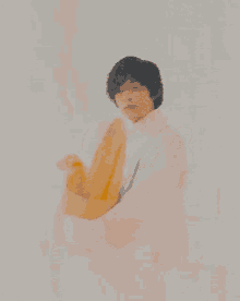 a man in a pink dress is holding a bottle of orange juice