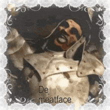 a man in a knight 's armor is holding a knife in his hand and smiling .