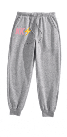 a pair of grey sweatpants with a lightning bolt and the letter kk on the side