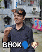 a man wearing dog ears and the word bhok on his chest