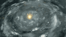 a swirl of clouds with a light coming out of the middle