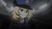 a girl with blonde hair wearing a blue hat with bc on it