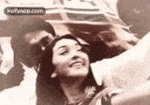 a woman is taking a selfie with a man in a car .