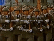 a group of soldiers marching in a line with the words soldaten marsch marsch marsch written on the bottom