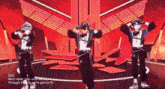 three anime characters are dancing in front of a red background with the words we 'll never stop until we die through the fire