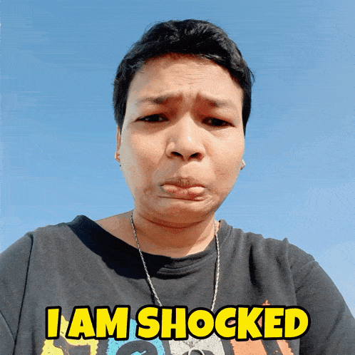 a woman wearing a black shirt that says 