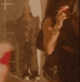 a woman holding a red cup with a leopard print coat in the background