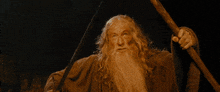 a man with a beard is holding a sword and says " shall not " on the bottom