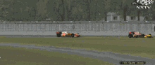 three race cars are racing on a track with nxtv written on the bottom